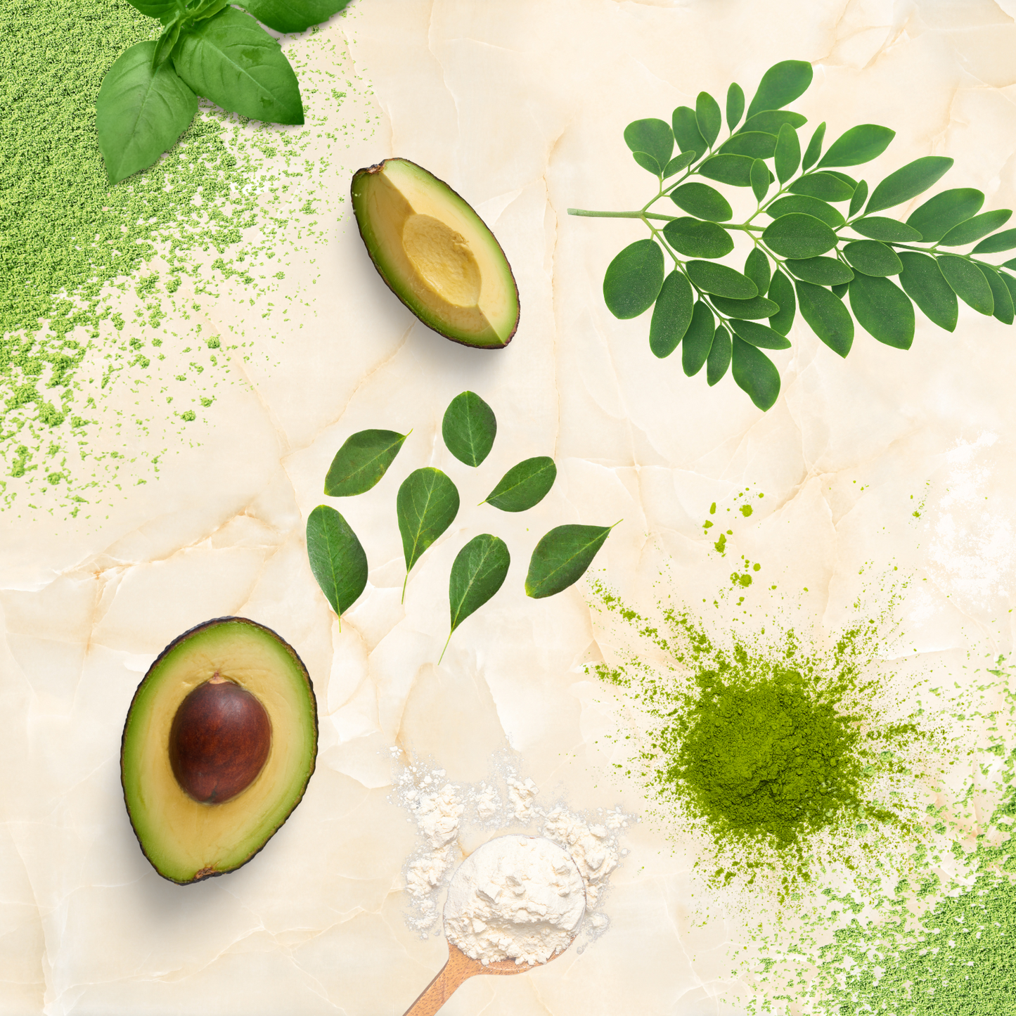 Raw ingredients for A botanical face mask product called Cali'Cado | Basil Matcha'cado RENEWAL on a tan marble like surface