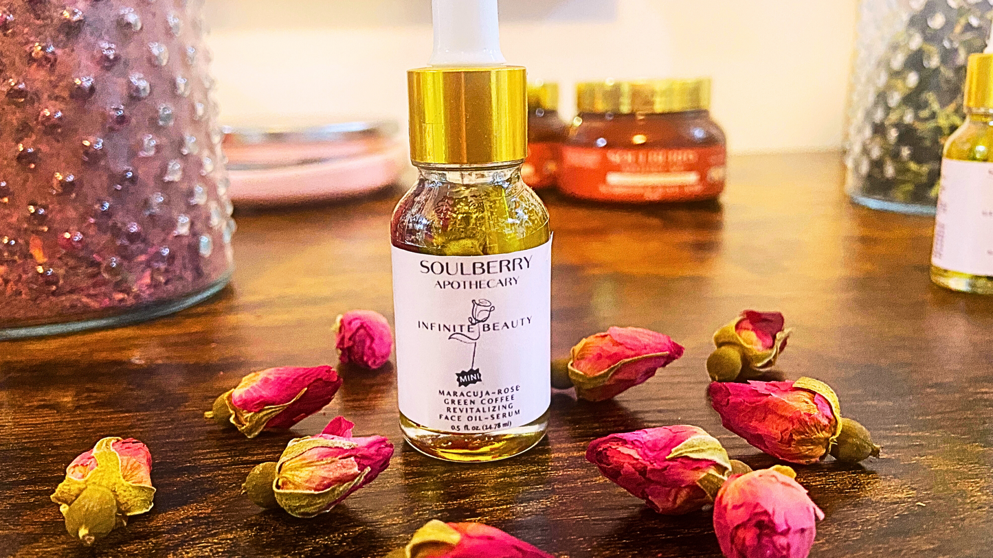 A 0.5oz bottle of anti-aging botanical face oil on a wooden table and surrounded by osebuds at the base